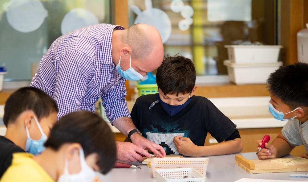 An ISB teacher working with students