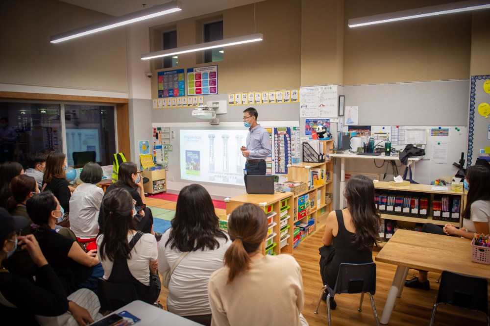 Parents listening to a talk in an Elementary School classroom