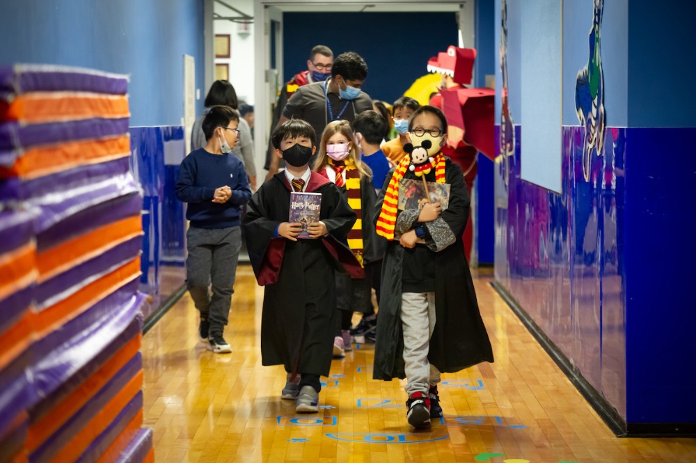 Elementary School students dressed as literary characters take part in a parade