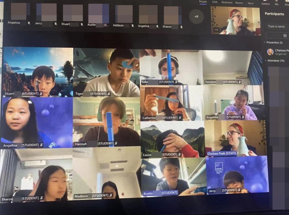 A screenshot of students holding up blue household objects during a Teams calls