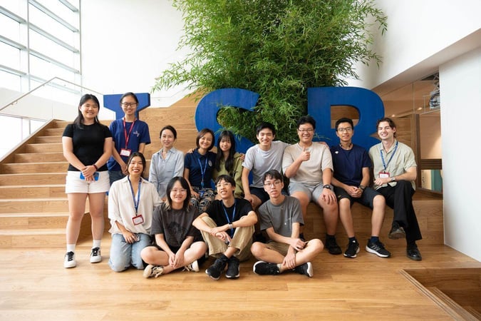 A group shot of students participating in the Columbia University Symposium Club at ISB